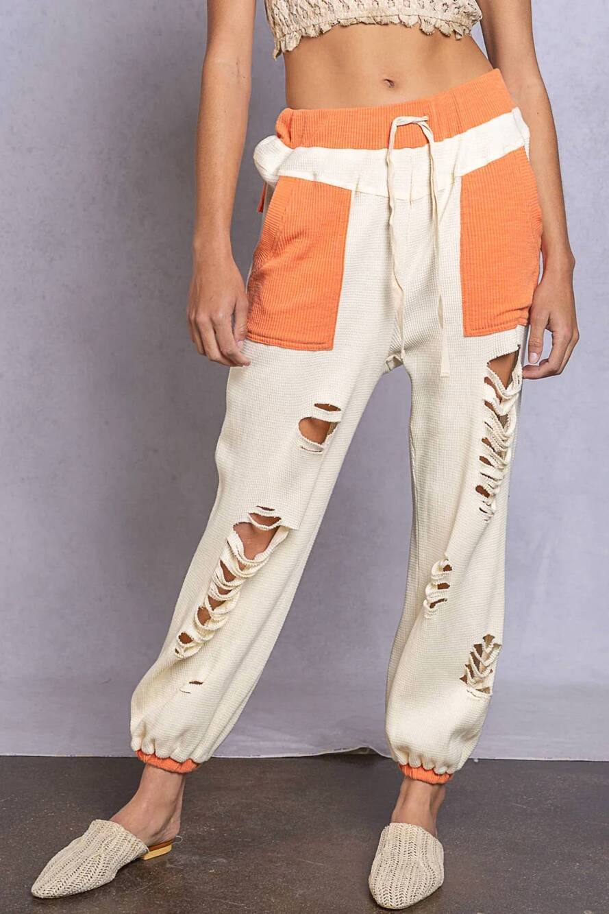 NEW POL distressed joggers in ivory and orange